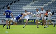 30 May 2021; David Hyland of Kildare is tackled by John O'Loughlin of Laois during the Allianz Football League Division 2 South Round 3 match between Laois and Kildare at MW Hire O'Moore Park in Portlaoise, Laois. Photo by Piaras Ó Mídheach/Sportsfile