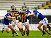 6 June 2021; Tommy Walsh of Kilkenny is tackled by Eoin Gaughan, left, and Ross King of Laois during the Allianz Hurling League Division 1 Group B Round 4 match between Kilkenny and Laois at UPMC Nowlan Park in Kilkenny. Photo by Eóin Noonan/Sportsfile