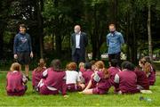 11 June 2021; Minister of State for Sport and the Gaeltacht Jack Chambers TD with 6th class pupils from his former school St. Brigid's National School with, from left, CEO Athletics Ireland Hamish Adams and class teacher Patrick Lowery at the Daily Mile launch at St. Brigid's National School, Beechpark Lawn, Castleknock in Dublin.  Photo by Matt Browne/Sportsfile