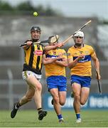 12 June 2021; Darragh Corcoran of Kilkenny in action against David Reidy, left, and Aidan McCarthy of Clare during the Allianz Hurling League Division 1 Group B Round 5 match between Clare and Kilkenny at Cusack Park in Ennis, Clare. Photo by Ramsey Cardy/Sportsfile