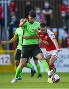 21 June 2021; Robbie Benson of St Patrick's Athletic in action against Kosovar Sadiki of Finn Harps during the SSE Airtricity League Premier Division match between St Patrick's Athletic and Finn Harps at Richmond Park in Dublin. Photo by Harry Murphy/Sportsfile