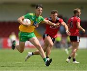 27 June 2021; Michael Langan of Donegal in action against Pierce Laverty of Down during the Ulster GAA Football Senior Championship Preliminary Round match between Down and Donegal at Páirc Esler in Newry, Down. Photo by Ramsey Cardy/Sportsfile
