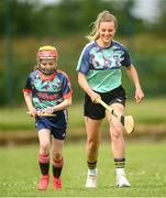 28 June 2021; Kilkenny camogie star, Grace Walsh was on hand with Grainne O'Brien, age 10, in Bruff GAA Club, Limerick to mark the first day of this year’s Kellogg’s GAA Cúl Camps with numbers of over 130,000 expected to attend across 1,242 camps the length and breadth of the country. The 2021 Kellogg’s GAA Cúl Camps offers children a healthy, fun and safe summer outdoor activity at locations nationwide, and will continue until the end of August. Photo by Stephen McCarthy/Sportsfile
