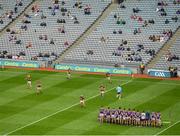 3 July 2021; Wexford players stand for the team photograph, as Kilkenny players warm-up, before the Leinster GAA Hurling Senior Championship Semi-Final match between Kilkenny and Wexford at Croke Park in Dublin. Photo by Seb Daly/Sportsfile