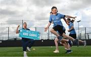 5 July 2021; Summer camps return this week to the Sport Ireland Campus, Blanchardstown, with the 'National Dairy Council School Sports Day'. In attendance during the event is Athletics coach and Olympian David Matthews, with camp participants, including Callum Grant, from Dublin, right, at the National Sports Campus in Blanchardstown, Dublin. Photo by Sam Barnes/Sportsfile