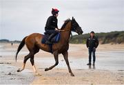 7 July 2021; Adam Caffrey onboard Spanish Tenor watched by trainer Ado McGuinness on the gallops at South Beach in Rush, Co Dublin as they gear up for the iconic Galway Races Summer Festival that takes place from Monday 26th July to Sunday 1st August. Photo by David Fitzgerald/Sportsfile