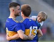10 July 2021; Brian Fox of Tipperary with his son Tadhg, and team-mate Shane O'Connell, after the Munster GAA Football Senior Championship Semi-Final match between Tipperary and Kerry at Semple Stadium in Thurles, Tipperary. Photo by Piaras Ó Mídheach/Sportsfile