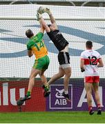 11 July 2021; Derry goalkeeper Oran Lynch in action against Michael Murphy of Donegal during the Ulster GAA Football Senior Championship Quarter-Final match between Derry and Donegal at Páirc MacCumhaill in Ballybofey, Donegal. Photo by Stephen McCarthy/Sportsfile