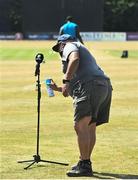 24 July 2021; The microphone is sanitised prior to the Men's T20 International match between Ireland and South Africa at Stormont in Belfast. Photo by David Fitzgerald/Sportsfile