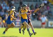 20 July 2013; Eimear Considine, Clare, in action against Fiona Kavanagh, Wexford. Liberty Insurance Senior Camogie Championship, Group 1, Wexford v Clare, Wexford Park, Wexford. Picture credit: David Maher / SPORTSFILE
