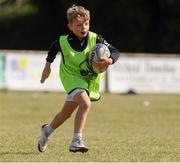 28 July 2021; Ollie Holden, age 7, in action during the Bank of Ireland Leinster Rugby Summer Camp at Kilkenny RFC in Kilkenny. Photo by Matt Browne/Sportsfile
