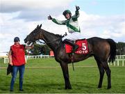 28 July 2021; Jockey Paul Townend celebrates after winning the Tote Galway Plate Steeplechase on Royal Rendezvous with groom Janet Fitzgerald during day three of the Galway Races Summer Festival at Ballybrit Racecourse in Galway. Photo by David Fitzgerald/Sportsfile