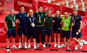 3 August 2021; Bronze medalists Aidan Walsh of Ireland with backroom team, from left, Dr Jim Clover, physiotherapist Lorcan McGee, coach Zaur Antia, high performance director Bernard Dunne, Michaela Walsh, coach Dmitry Dmitruk and sports performance coach Kevin McManamon after the victory ceremony at the Kokugikan Arena during the 2020 Tokyo Summer Olympic Games in Tokyo, Japan.  Photo by Brendan Moran/Sportsfile