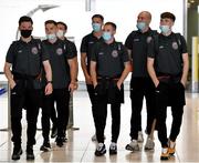 10 August 2021; Bohemians players, from left, Ali Coote, Anto Breslin, Keith Buckley, Rob Cornwall, Liam Burt, Georgie Kelly and Stephen Mallon at Dublin Airport prior to their side's departure to Greece for their UEFA Europa Conference League third qualifying round second leg match against PAOK. Photo by Seb Daly/Sportsfile