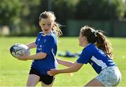 13 August 2021; Mia van der Krogt, age 9, and April Murphy, age 9, in action during the Bank of Ireland Leinster Rugby Summer Camp at Tallaght RFC in Dublin. Photo by Seb Daly/Sportsfile