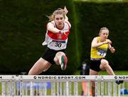 14 August 2021; Ava McKeon from Galway City Harriers AC, on her way to winning the under-17 100m Hurdles during day six of the Irish Life Health National Juvenile Track & Field Championships at Tullamore Harriers Stadium in Tullamore, Offaly. Photo by Matt Browne/Sportsfile