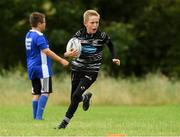 17 August 2021; Donnchadh Lyons, age 10, in action during the Bank of Ireland Leinster Rugby Summer Camp at Dundalk RFC in Dundalk. Photo by Matt Browne/Sportsfile