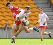 21 August 2021; Gavin Potter of Tyrone in action against Shane OP'Connell of Cork during the 2021 Electric Ireland GAA Football All-Ireland Minor Championship Semi-Final match between Cork and Tyrone at Bord Na Mona O'Connor Park in Tullamore, Offaly. Photo by Matt Browne/Sportsfile