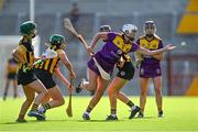 21 August 2021; Jackie Quigley of Wexford in action against Kilkenny players, from left, Michelle Teehan, Miriam Walsh and Claire Phelan during the All-Ireland Senior Camogie Championship quarter-final match between Kilkenny and Wexford at Páirc Uí Chaoimh in Cork. Photo by Piaras Ó Mídheach/Sportsfile