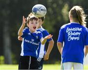 24 August 2021; Shay Coffey, age 6, in action during the Bank of Ireland Leinster Rugby Summer Camp at Cill Dara RFC in Kildare. Photo by Matt Browne/Sportsfile