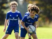 24 August 2021; Fionn Kerr, age 7, in action during the Bank of Ireland Leinster Rugby Summer Camp at Cill Dara RFC in Kildare. Photo by Matt Browne/Sportsfile