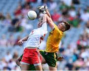 28 August 2021; Meath goalkeeper Oisín McDermott punches the ball away from Jack Martin of Tyrone during the Electric Ireland GAA Football All-Ireland Minor Championship Final match between Meath and Tyrone at Croke Park in Dublin. Photo by Piaras Ó Mídheach/Sportsfile