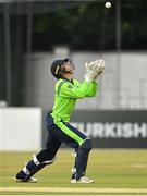 29 August 2021; Ireland wicketkeeper Neil Rock catches Zimbabwe's Wessley Madhevere during match two of the Dafanews T20 series between Ireland and Zimbabwe at Clontarf Cricket Club in Dublin. Photo by Seb Daly/Sportsfile
