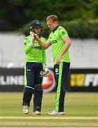 29 August 2021; Ireland wicketkeeper Neil Rock, left, and Shane Getkate congratulate each other after taking the wicket of Zimbabwe's Wessley Madhevere during match two of the Dafanews T20 series between Ireland and Zimbabwe at Clontarf Cricket Club in Dublin. Photo by Seb Daly/Sportsfile