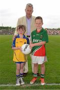 21 July 2013; Ellen Hynes, from Four Roads, Co. Roscommon, and Mark Gibbons, from Claremorris, Co. Mayo, with Kevin Molloy, CRM, Electric Ireland, are pictured at the Electric Ireland Connacht GAA Minor Football Championship Final, where they were the official ball-carriers and had the honour of presenting the match ball to the referee before the game. Ellen and Mark won their prizes through Electric Ireland’s Facebook page www.facebook.com/ElectricIreland. Electric Ireland Connacht GAA Football Minor Championship Final, Roscommon v Mayo, Elverys MacHale Park, Castlebar, Co. Mayo. Picture credit: Stephen McCarthy / SPORTSFILE