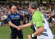 21 July 2013; Jim McGuinness, Donegal manager shakes hands with, Monaghan manager Malachy O'Rourke, before the final whistle. Ulster GAA Football Senior Championship Final, Donegal v Monaghan, St Tiernach's Park, Clones, Co. Monaghan. Picture credit: Oliver McVeigh / SPORTSFILE