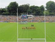 21 July 2013; The Monaghan and Donegal teams stand together for the National Anthem. Ulster GAA Football Senior Championship Final, Donegal v Monaghan, St Tiernach's Park, Clones, Co. Monaghan. Picture credit: Daire Brennan / SPORTSFILE