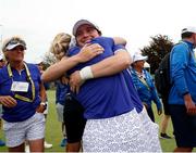 4 September 2021; Leona Maguire of Team Europe gets a hug from teammate Sophia Popov after winning her match on the 18th green during the afternoon fourballs on day one of the Solheim Cup at the Inverness Club in Toledo, Ohio, USA. Photo by Brian Spurlock/Sportsfile