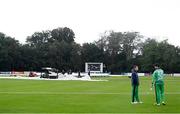 10 September 2021; Josh Little, left, and George Dockrell of Ireland inspect the pitch during a rain delay during match two of the Dafanews International Cup ODI series between Ireland and Zimbabwe at Stormont in Belfast. Photo by Ramsey Cardy/Sportsfile