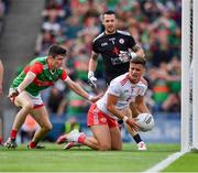 11 September 2021; Michael McKernan of Tyrone, under pressure from Conor Loftus of Mayo, prepares to clear during the GAA Football All-Ireland Senior Championship Final match between Mayo and Tyrone at Croke Park in Dublin. Photo by Ray McManus/Sportsfile