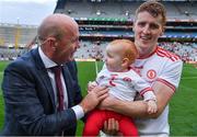 11 September 2021; Former Tyrone All Ireland winning captain Peter Canavan in conversation with his son in law Peter Harte of Tyrone and his 10 month old grandchild Ava after the GAA Football All-Ireland Senior Championship Final match between Mayo and Tyrone at Croke Park in Dublin. Photo by Ray McManus/Sportsfile