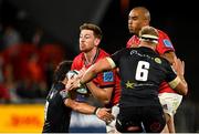 25 September 2021; Ben Healy of Munster is tackled by Boeta Chamberlain, left, and Dylan Richardson of Cell C Sharks, supported by team-mate Simon Zebo, during the United Rugby Championship match between Munster and Cell C Sharks at Thomond Park in Limerick. Photo by Seb Daly/Sportsfile