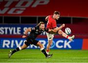 25 September 2021; Rory Scannell of Munster in action against Werner Kok of Cell C Sharks during the United Rugby Championship match between Munster and Cell C Sharks at Thomond Park in Limerick. Photo by Seb Daly/Sportsfile