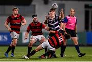 1 October 2021; James Sullivan of Terenure College attempts to gather a loose ball as he is tackled by Adam Corcoran of Dublin University FC during the Metropolitan Cup Final match between Dublin University FC and Terenure College at Energia Park in Dublin. Photo by Ben McShane/Sportsfile