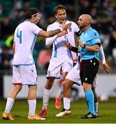 8 October 2021;  Luxembourg players, Kevin D'Anzico, left, and Mathias Olesen protest to referee Besfort Kasumi during the UEFA European U21 Championship Qualifier match between Republic of Ireland and Luxembourg at Tallaght Stadium in Dublin.  Photo by Eóin Noonan/Sportsfile