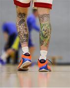 9 October 2021; The tattoos on the legs of Lorcan Murphy of Griffith College Templeogue before the InsureMyVan.ie Men's Super League North Conference match between DCU St Vincent's and Griffith College Templeogue at DCU Sports Complex in Dublin. Photo by Daniel Tutty/Sportsfile