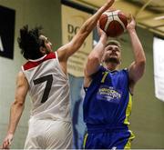 9 October 2021; Graham Branelly of DCU St. Vincent's has his shot blocked by Melini Enrique of Griffith College Templeogue during the InsureMyVan.ie Men's Super League North Conference match between DCU St Vincent's and Griffith College Templeogue at DCU Sports Complex in Dublin. Photo by Daniel Tutty/Sportsfile