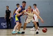 9 October 2021; Vladimir Tokishin of Griffith College Templeogue in action against Graham Branelly of DCU St. Vincent's during the InsureMyVan.ie Men's Super League North Conference match between DCU St Vincent's and Griffith College Templeogue at DCU Sports Complex in Dublin. Photo by Daniel Tutty/Sportsfile