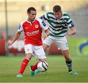 23 July 2013; Christy Fagan, St. Patrick's Athletic, in action against Jason McGuinness, Shamrock Rovers. EA Sports Quarter-Final, Shamrock Rovers v St. Patrick's Athletic, Tallaght Stadium, Tallaght, Dublin. Picture credit: David Maher / SPORTSFILE
