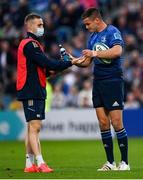 16 October 2021; Jonathan Sexton of Leinster with acting water carrier Nick McCarthy during the United Rugby Championship match between Leinster and Scarlets at the RDS Arena in Dublin. Photo by Harry Murphy/Sportsfile