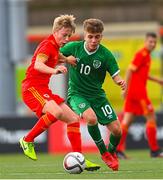 19 October 2021; Jacob Cook of Wales in action against Naz Raji of Republic of Ireland during the Victory Shield match between Wales and Republic of Ireland at Seaview in Belfast. Photo by Ramsey Cardy/Sportsfile