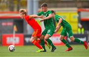 19 October 2021; Jacob Cook of Wales in action against Taylor Mooney of Republic of Ireland during the Victory Shield match between Wales and Republic of Ireland at Seaview in Belfast. Photo by Ramsey Cardy/Sportsfile