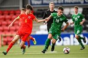 19 October 2021; Taylor Mooney of Republic of Ireland in action against Charlie Crew of Wales during the Victory Shield match between Wales and Republic of Ireland at Seaview in Belfast. Photo by Ramsey Cardy/Sportsfile