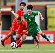 19 October 2021; Eoin Sheeran of Republic of Ireland evades the tackle of Joe Belmont of Wales during the Victory Shield match between Wales and Republic of Ireland at Seaview in Belfast. Photo by Ramsey Cardy/Sportsfile