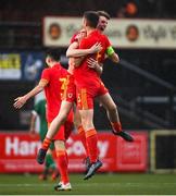 19 October 2021; Dan Cox, left, and Dylan Lawlor of Wales celebrate at the final whistle of the Victory Shield match between Wales and Republic of Ireland at Seaview in Belfast. Photo by Ramsey Cardy/Sportsfile