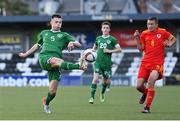 19 October 2021; Adam Queally of Republic of Ireland in action against Joe Belmont of Wales during the Victory Shield match between Wales and Republic of Ireland at Seaview in Belfast. Photo by Ramsey Cardy/Sportsfile